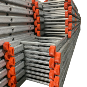 Stack of Tuff Steel 5m heavy-duty galvanised steel pole ladders with durable orange rubber feet for stability