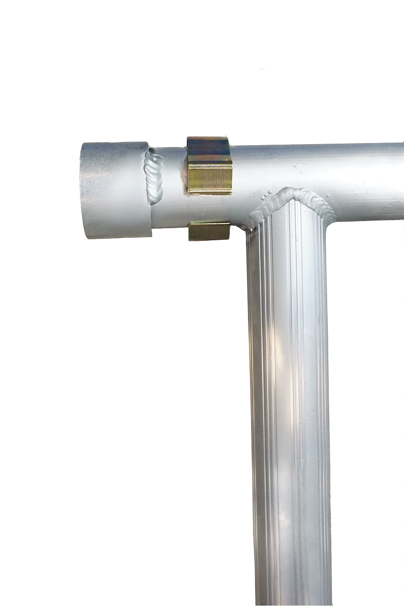 Detailed close-up of welded T-junction on LyteMate Mobile Work Platform, aluminium tube with visible weld bead, brass reinforcement plate, and curved connection, highlighting durable construction of the 600mm height mobile aluminium podium by Lyte Ladders